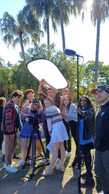 Photo of students working on set