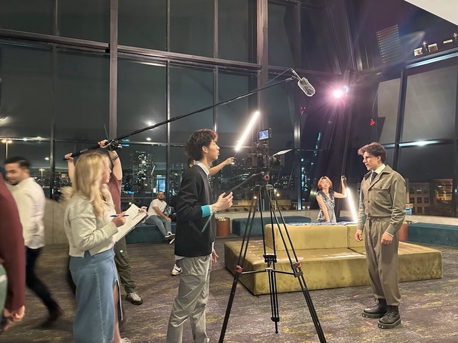 Photo of students working on set